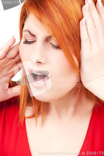 Image of unhappy redhead woman