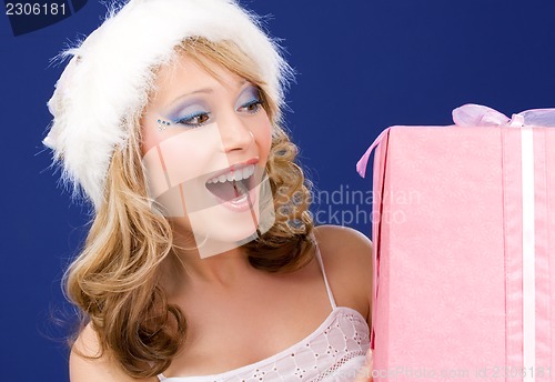 Image of happy santa helper with gift box