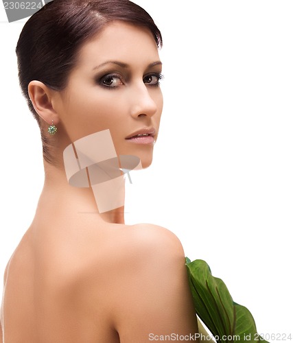 Image of woman with green leaf