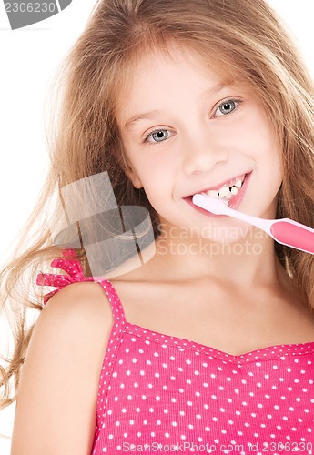 Image of happy girl with toothbrush