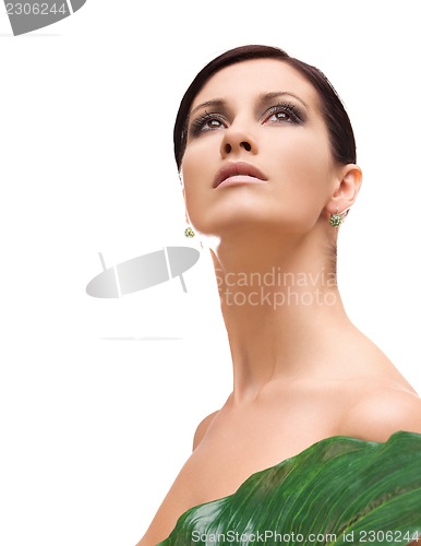Image of woman with green leaf
