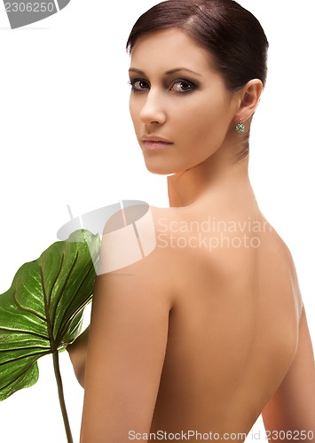 Image of woman with green leaf