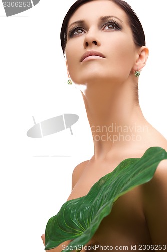 Image of woman with green leaf
