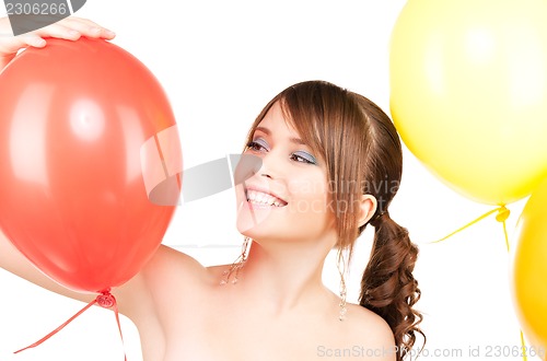 Image of happy teenage girl with balloons