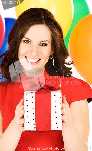 Image of woman with gift box and balloons