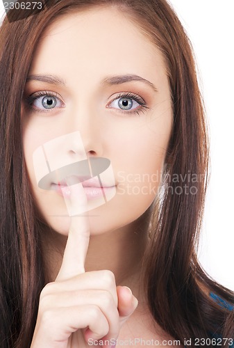 Image of finger on lips