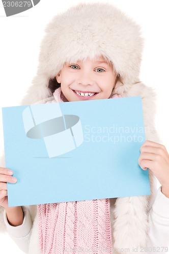 Image of girl in winter hat with blank board