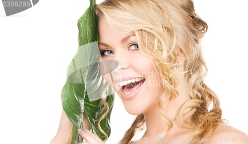 Image of woman with green leaf