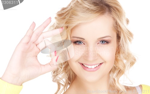 Image of lovely blonde showing ok sign