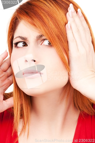 Image of unhappy redhead woman