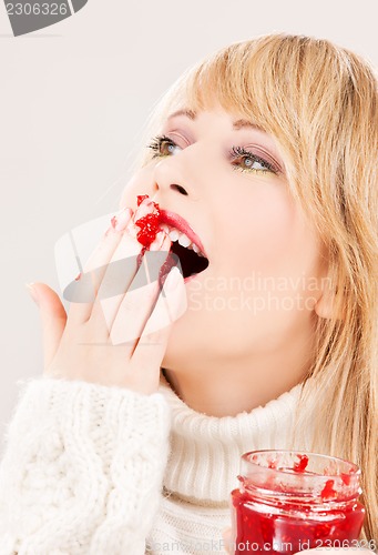 Image of happy teenage girl with raspberry jam