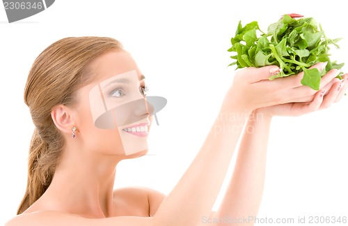 Image of happy woman with spinach