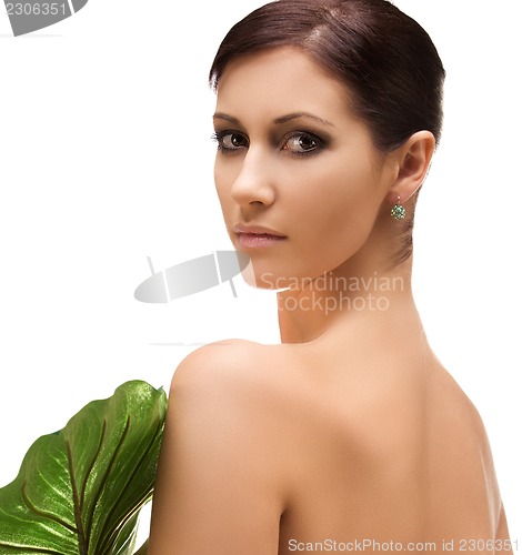 Image of woman with green leaf