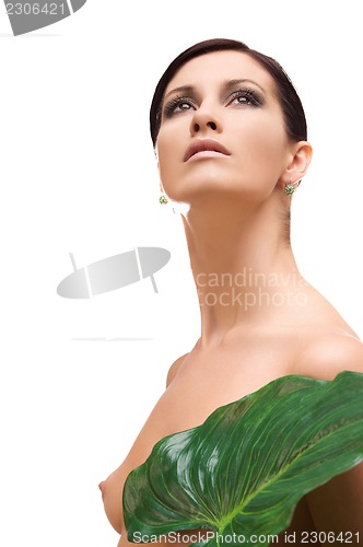 Image of woman with green leaf