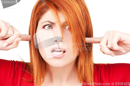 Image of unhappy redhead woman