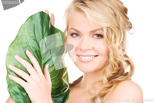 Image of woman with green leaf