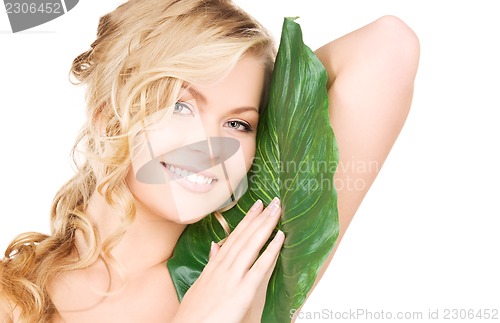 Image of woman with green leaf