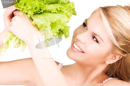 Image of happy woman with lettuce