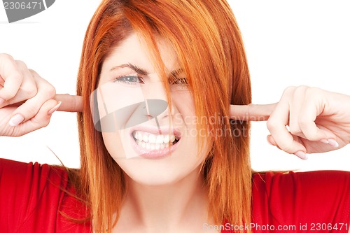 Image of unhappy redhead woman