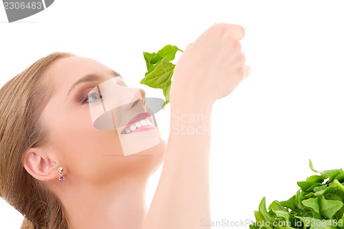 Image of happy woman with spinach