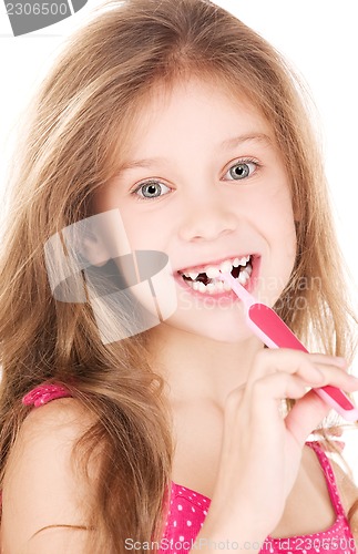 Image of happy girl with toothbrush