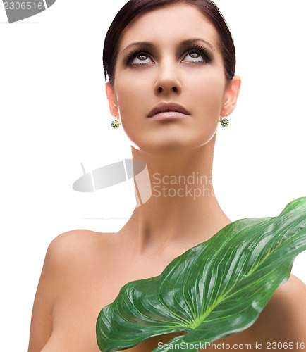 Image of woman with green leaf