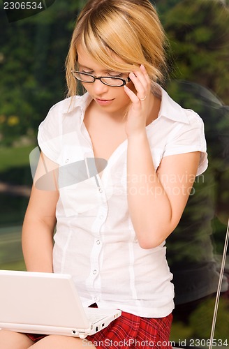 Image of office girl with laptop computer