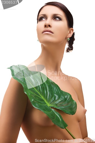 Image of woman with green leaf