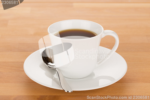 Image of Cup of coffee and silver spoon