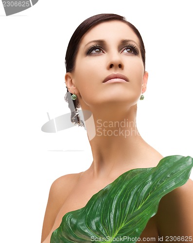Image of woman with green leaf