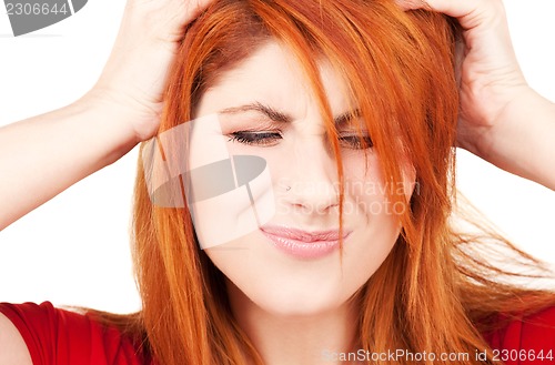 Image of unhappy redhead woman