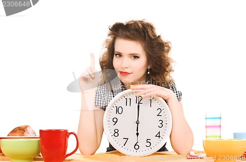 Image of young attractive woman in the kitchen