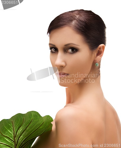 Image of woman with green leaf