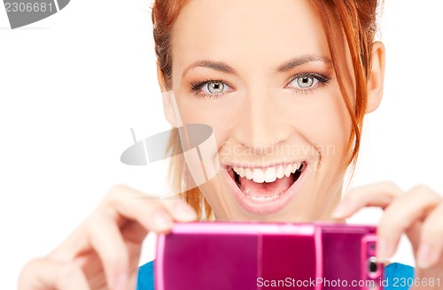 Image of happy woman using phone camera