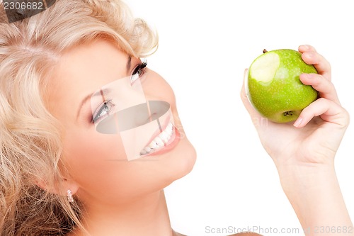 Image of young beautiful woman with green apple