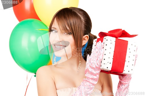 Image of party girl with balloons and gift box