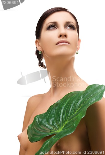 Image of woman with green leaf