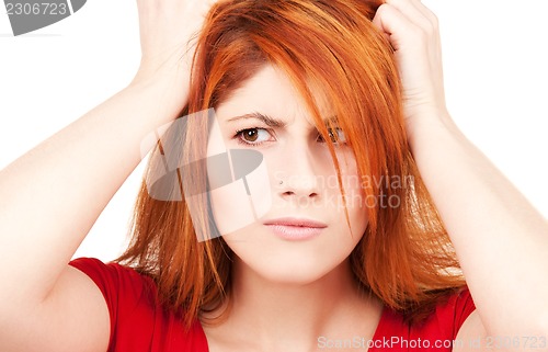 Image of unhappy redhead woman