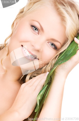 Image of woman with green leaf