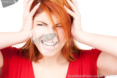 Image of unhappy redhead woman