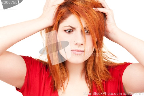 Image of unhappy redhead woman