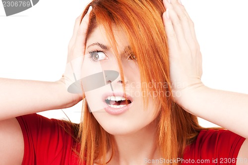 Image of unhappy redhead woman