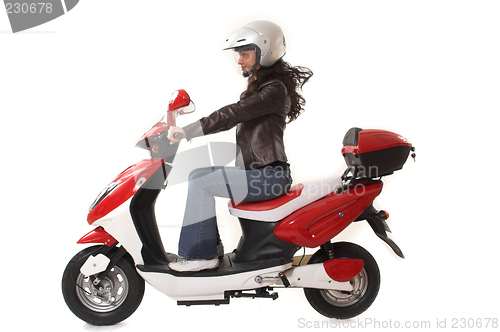 Image of woman riding scooter