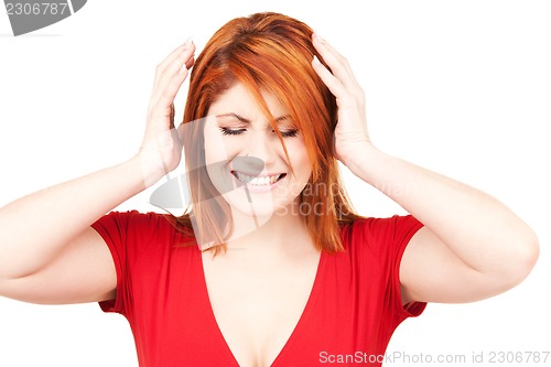 Image of unhappy redhead woman