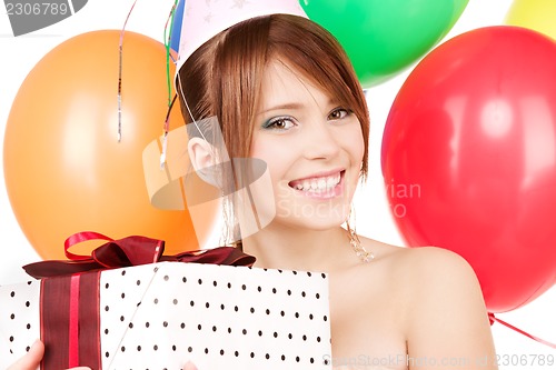 Image of party girl with balloons and gift box