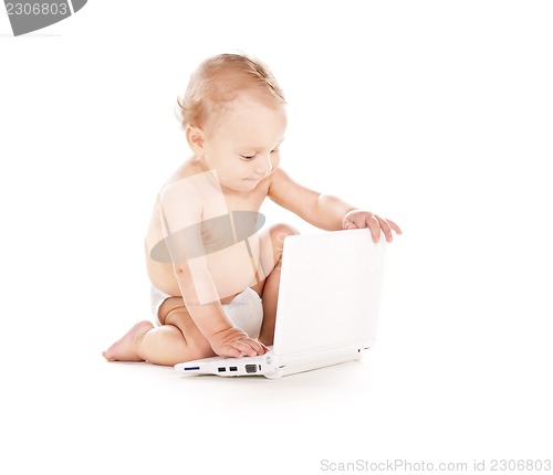 Image of baby boy with laptop computer