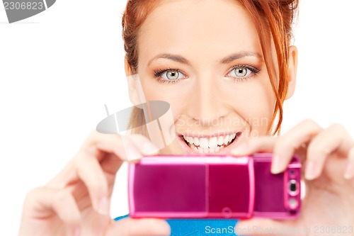 Image of happy woman using phone camera