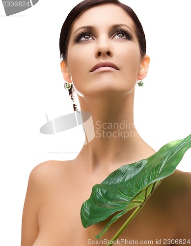 Image of woman with green leaf