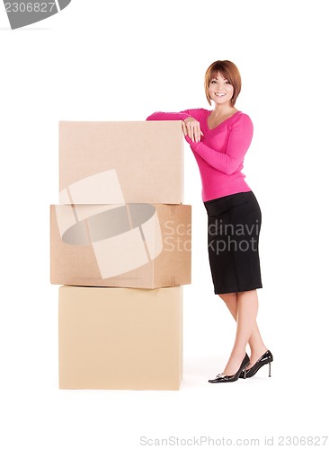 Image of businesswoman with boxes