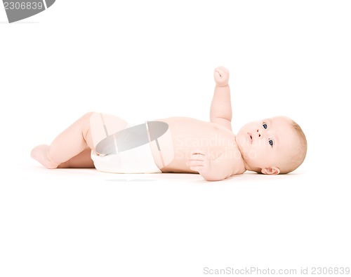 Image of laying baby boy in diaper